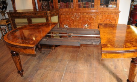 Setting up the leaf system on a walnut Victorian dining table