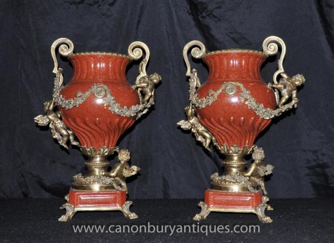 Pair French Porcelain Cherub Urns Ormolu Vases